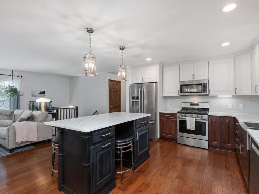 Kitchen with large center island and quartz counters. Perfect place to entertain and gather!