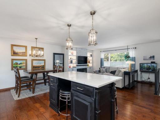 Kitchen, dining and living area all have hickory hardwood floors.