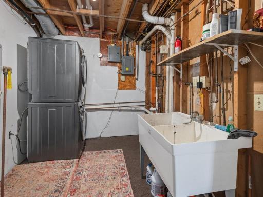 Laundry, utility sink are located in the large mechanical area.