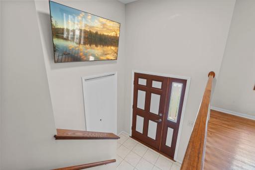 As you step inside, you're welcomed by a spacious foyer with soaring ceilings and a staircase leading to the bright, open-concept main level.