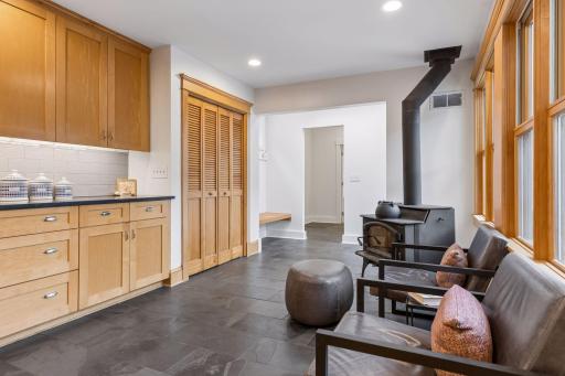 This is another space to gather, and cozy up to the fireplace. Note the amazing mudroom area here too.