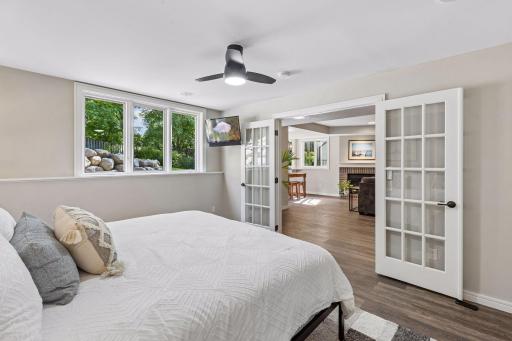 The lower level bedroom has look out windows that offer lots of natural light