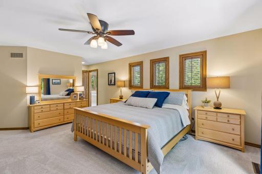 The spacious primary bedroom offers a peaceful retreat with abundant natural light.