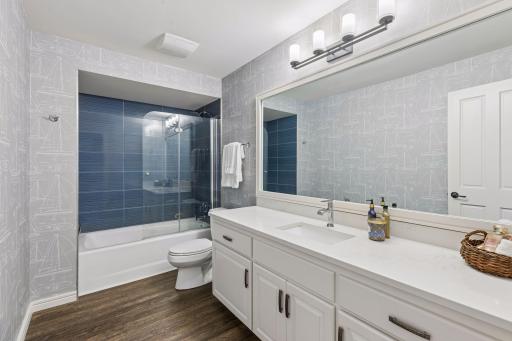 The renovated lower level full bathroom provides added convenience for guests and everyday living.