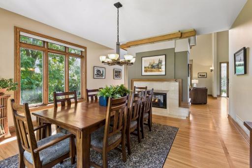 The double-sided gas fireplace brings warmth and ambiance to the dining room.