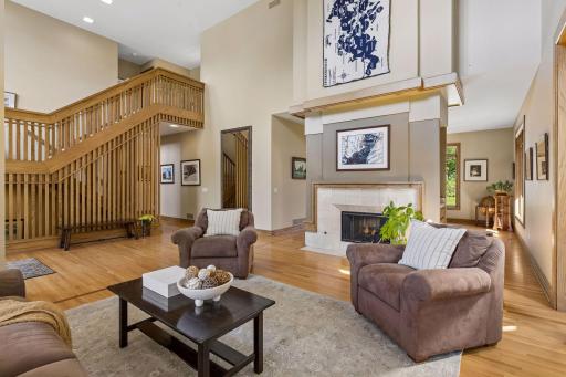 Open entryway and wonderful ceiling height in the living room complete with a fireplace.