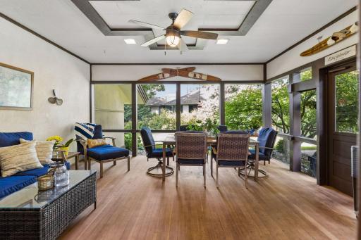 The expansive three-season porch offers a relaxing connection to the outdoors.