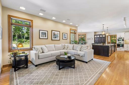 Main level family room is conveniently located off of the kitchen.