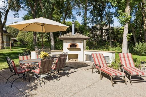 Wonderful patio with a built-in grill and pizza oven.