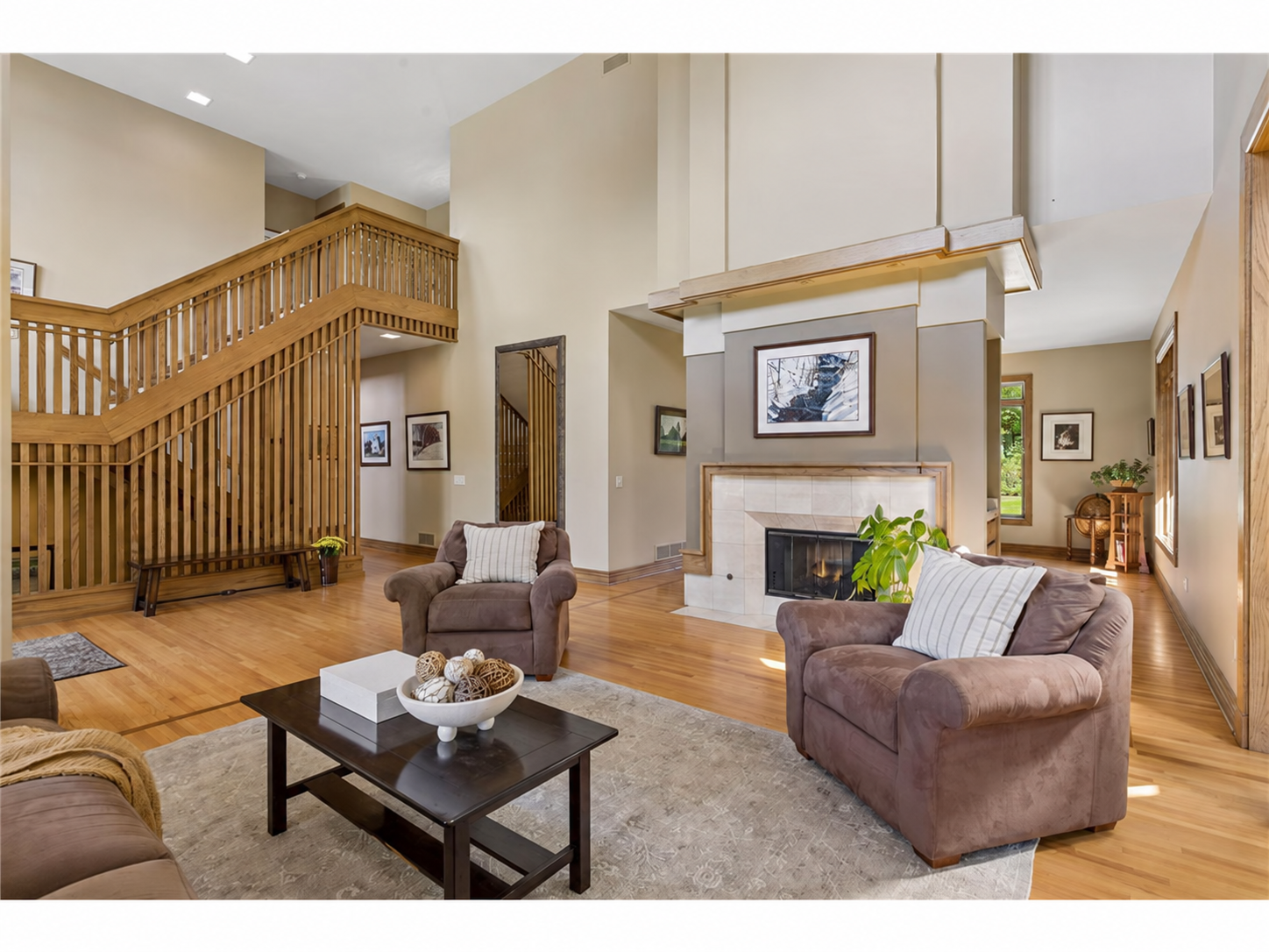 Open entryway and wonderful ceiling height in the living room complete with a fireplace.