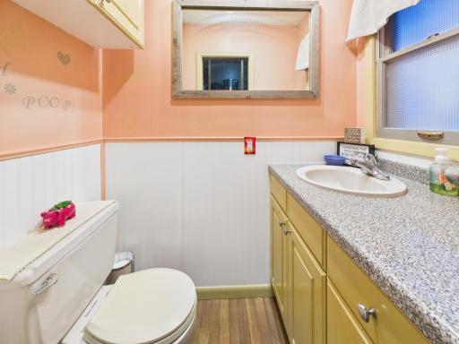 1/2 bath by the family room and garage entrance