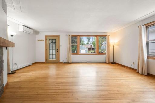 Main floor living room with newer A/C mini split.
