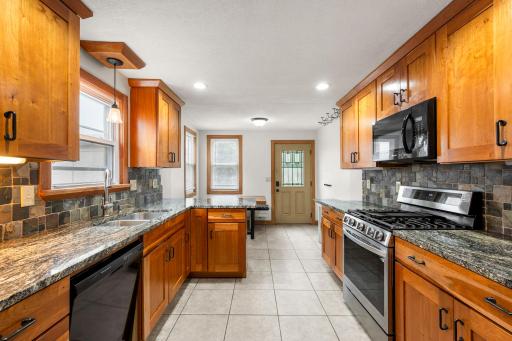 Newer refrigerator & range and eat-in kitchen.