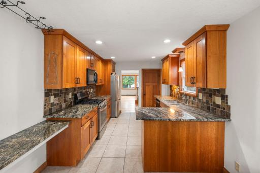 Beautiful cabinetry, granite countertops, & ceramic tile floors.