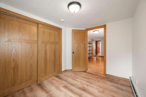 One of four upper level bedrooms with solid core paneled doors.