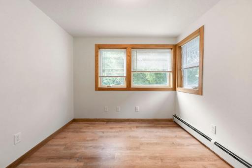 Upper level office space with new corner windows and LVP flooring.