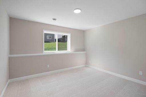 An optional bedroom in the finished basement offers a private space to rest and recharge