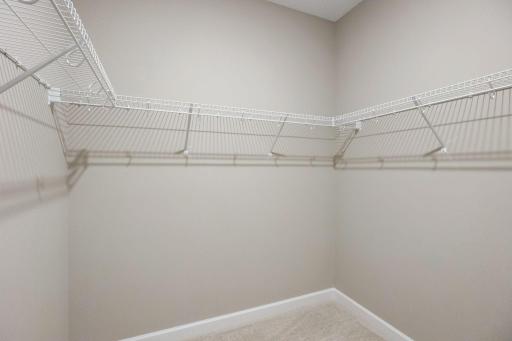 The walk-in closet offers plenty of room for clothes and accessories