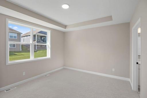 The ownerâs suite is a secluded retreat at the back of the home that features a spacious bedroom, en-suite bathroom and walk-in closet.