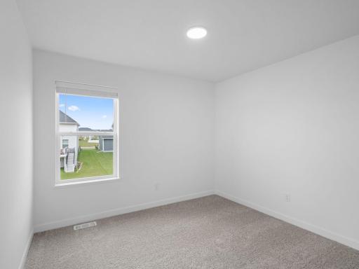 All the secondary bedrooms include a practical wardrobe closet and wall-to-wall carpeting for plush comfort.
