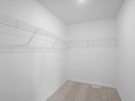 Fashion enthusiasts can store shared or growing wardrobes in the walk-in closet