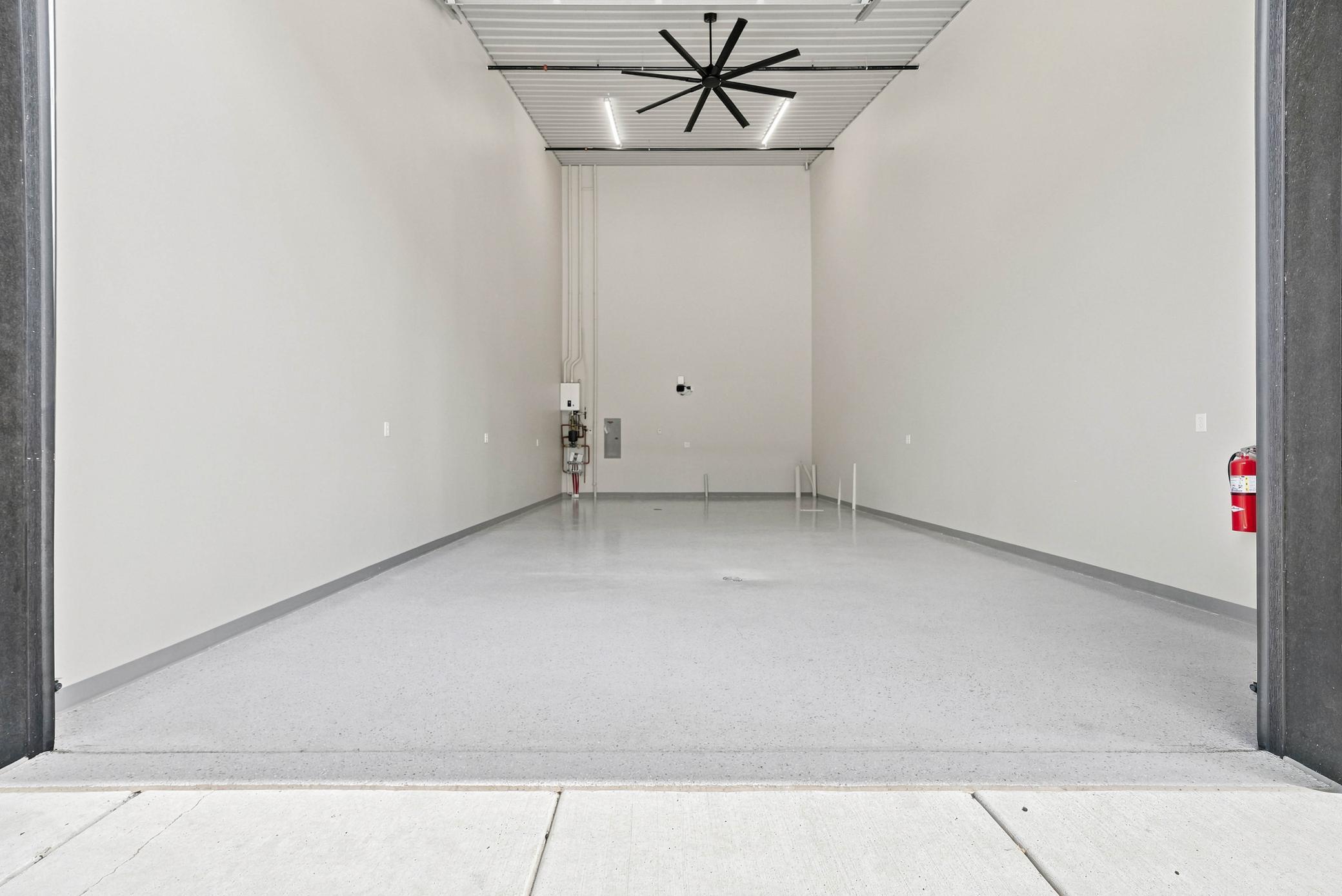 High ceilings, oversized doors, and durable finishes create a space built to handle everything from everyday storage to prized collections.