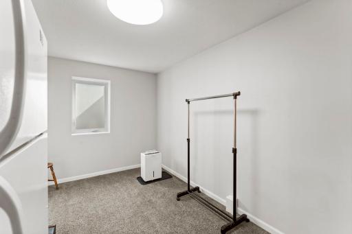 A perfect flex room! Additional bedroom, office, exercise room. Many options offered with egress window!