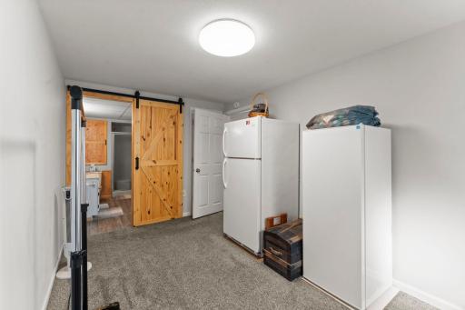 Stylish barn door to 3/4 basement bathroom.