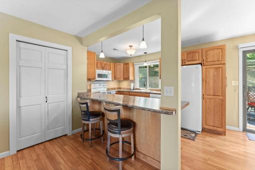 Remodeled kitchen features convenient breakfast bar for easy dining.