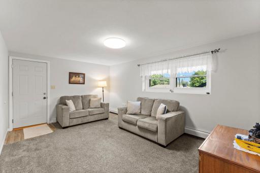 Amusement room offers lookout windows and newer carpeting.