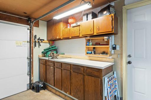 Tuckunder garage offers a ton of storage and workshop area.