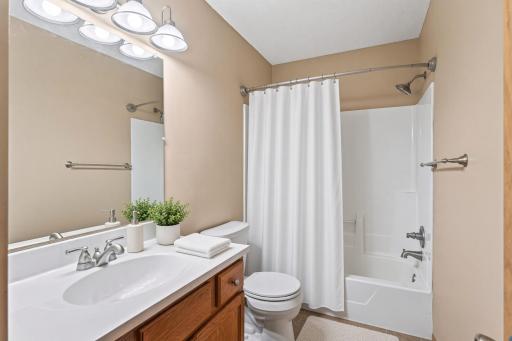 Virtually staged bathroom on the upper level.