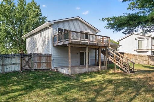 Two-tiered deck to be outside and enjoying your backyard!