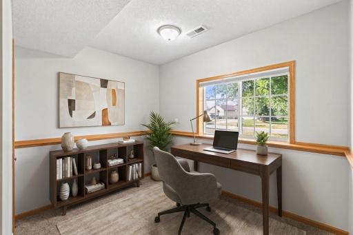 Virtually staged 3rd bedroom in the lower level. Can be a great work from home space!