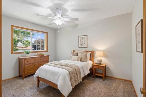 Virtually staged 2nd bedroom on the upper level.