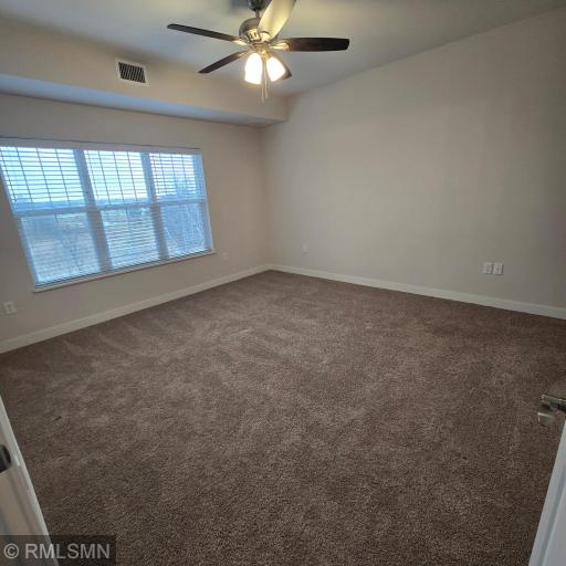 Private primary bedroom with walk in closet and bath