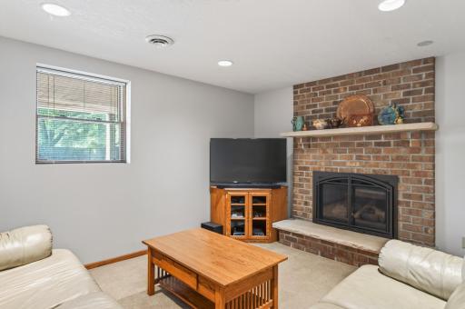 Recessed lighting and lookout windows ensure this lower level is bright and inviting.