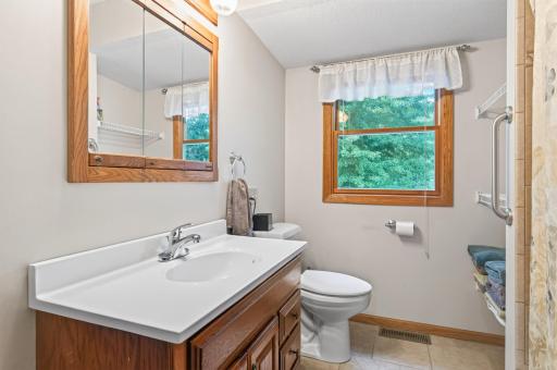 Main-level bathroom with a spacious vanity for storage.
