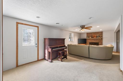 Walk-out lower-level family room offers additional space to gather and unwind.