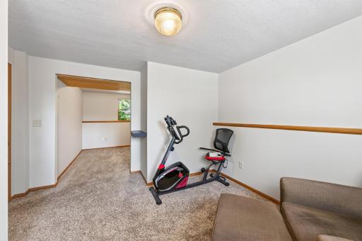 Oversized fourth bedroom offers potential to be divided into two separate bedrooms, creating an option for a fifth bedroom.