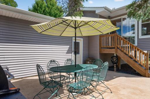 Patio area offers a great spot for outdoor dining and grilling.