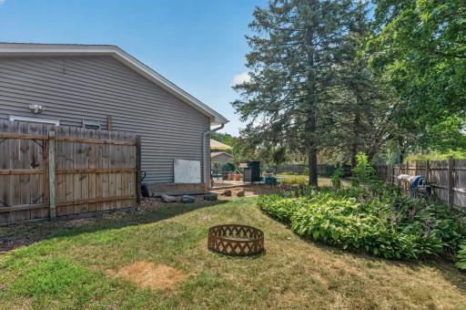 Fully fenced backyard provides space for outdoor activities beyond the pool area.