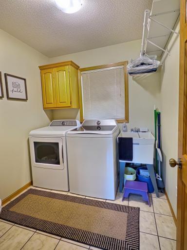 Laundry room with newer washer and dryer.