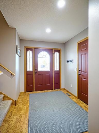 Large welcoming entryway with plenty of space for guests and storage.