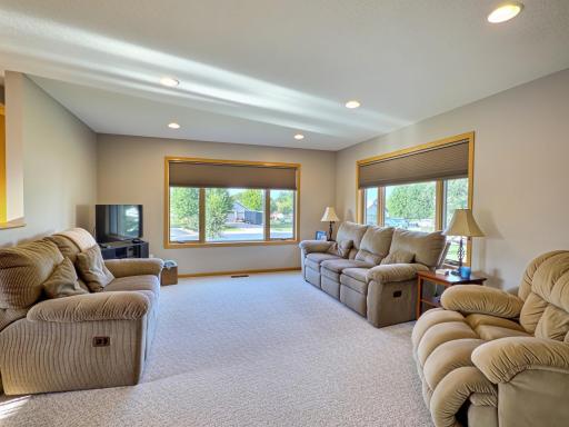 Generous family room offering a comfortable space to relax, gather, and entertain..