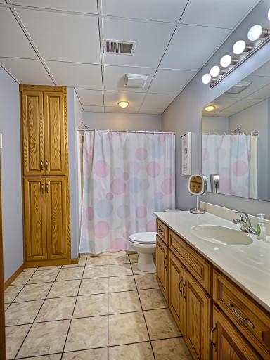 Large bathroom in the lower level, with tile floor.