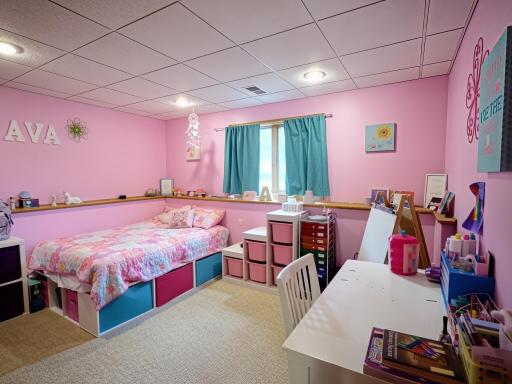 Second bedroom in the lower level, with lookout windows.