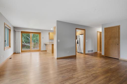 The open concept flows nicely from living room to dining room to kitchen.