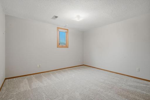 The 3rd of 4 bedrooms is located in the lower level and again - brand new carpet from Floor to Ceiling.