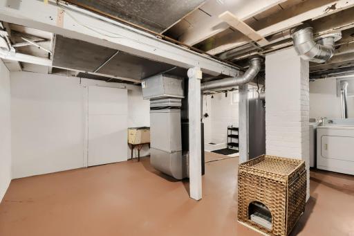 The freshly painted lower level offers plenty of storage and workspace, along with the washer and dryer and an additional showerâperfect for cleaning up after outdoor adventures or even giving your four-legged friend a bath!